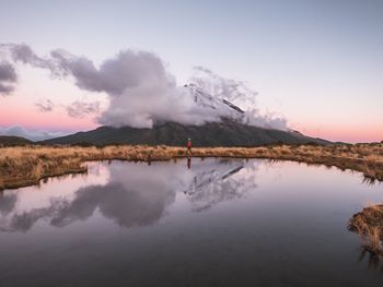 Scenic view of lake against sky during sunset