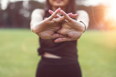 Young woman exercising at park