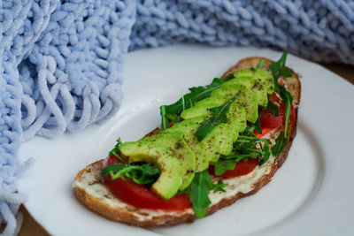 Close-up of breakfast served in plate on table