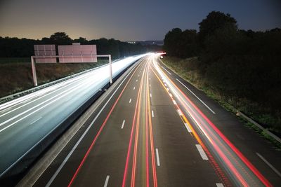 High angle view of light trails on road