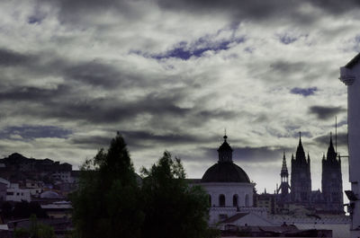 Silhouette of cathedral against cloudy sky