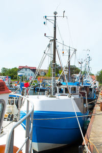 Boats moored at harbor