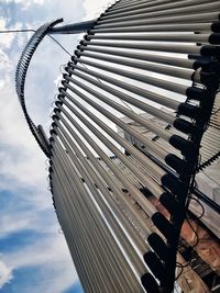 Low angle view of metallic structure against sky