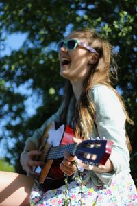 Young woman playing guitar