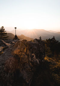 Scenic view of mountains against clear sky during sunset