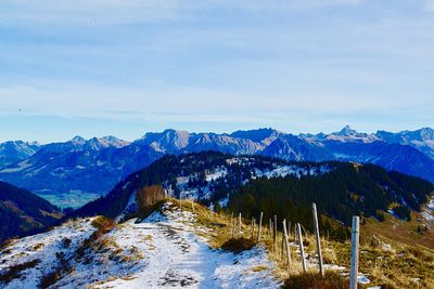 Scenic view of snowcapped mountains against sky