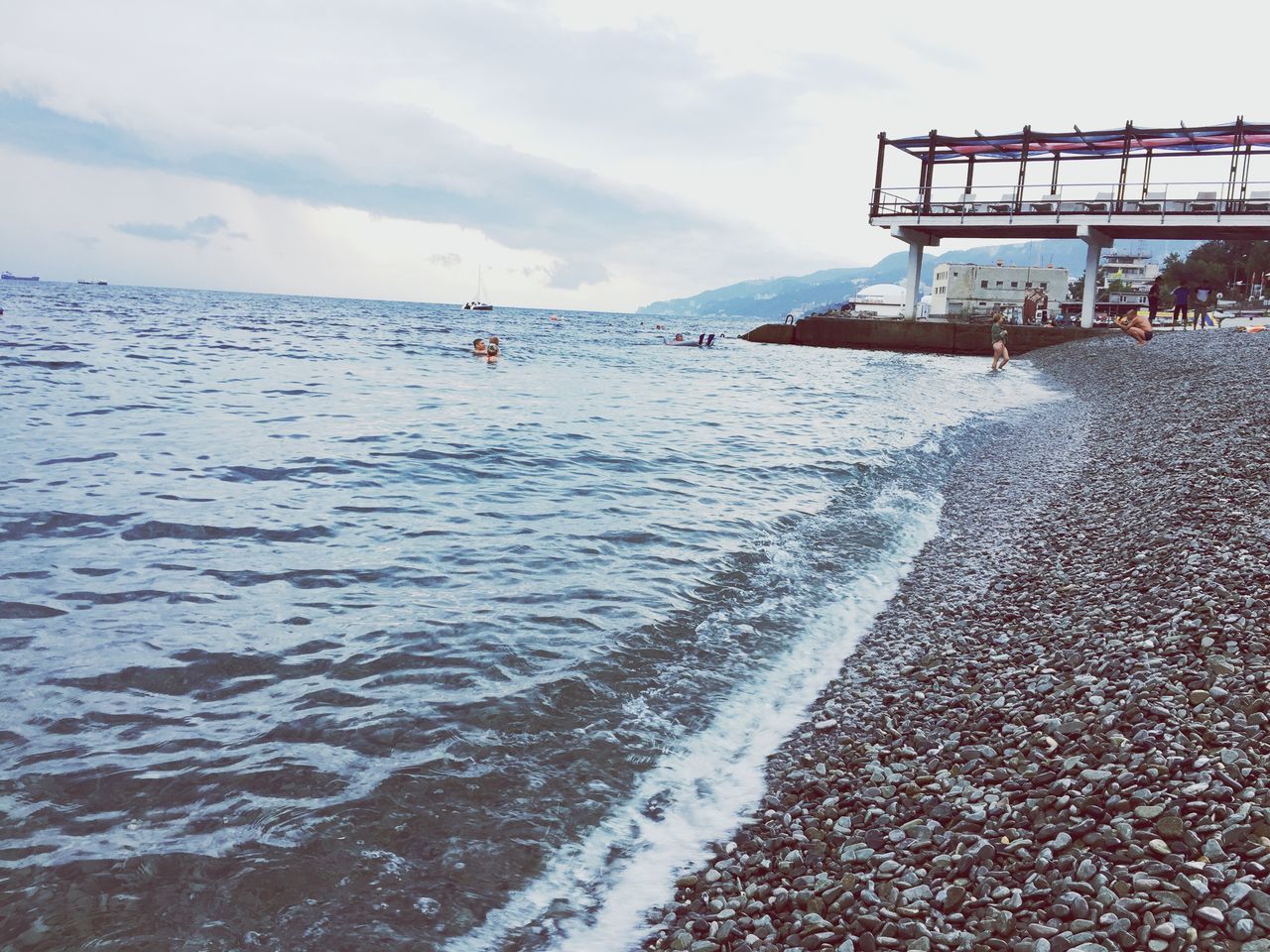 water, sky, wave, sea, scenics, tourism, mountain, outdoors, waterfront, beauty in nature, nature, cloud - sky, tranquil scene, day, tranquility, flowing, famous place, vacations, no people, international landmark, development