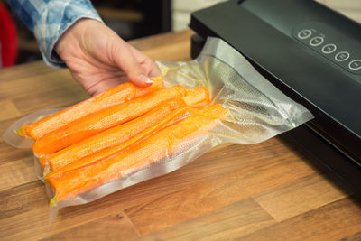 High angle view of person preparing food on table