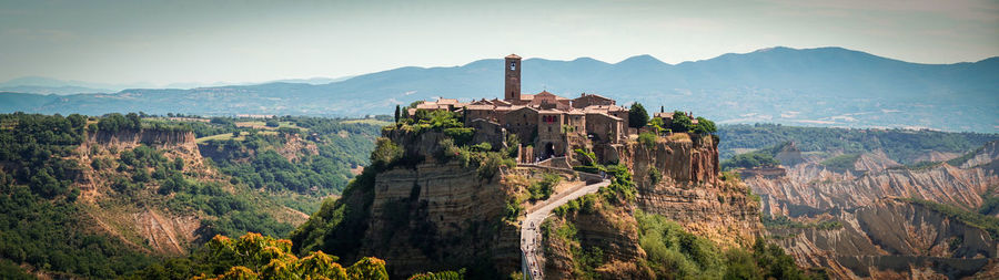 Panoramic view of castle on mountain against sky