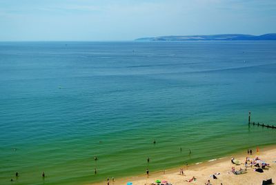 Scenic view of beach against blue sky