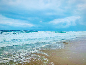 Scenic view of beach against sky