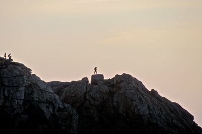 View of rock formations on mountain against sky