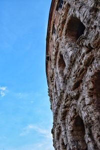 Low angle view of rock formation against sky