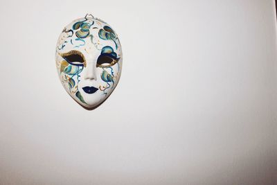 Venetian mask mounted on wall