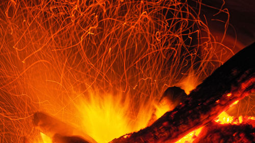 Low angle view of bonfire on fire at night