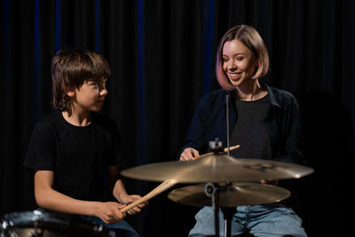 Young man playing drum