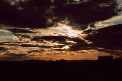 Scenic view of dramatic sky during sunset