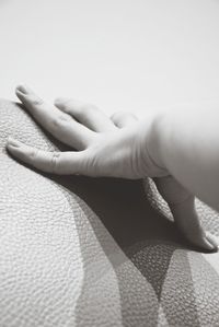 Close-up of person touching hand