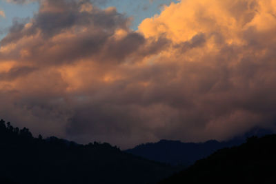 Low angle view of dramatic sky during sunset