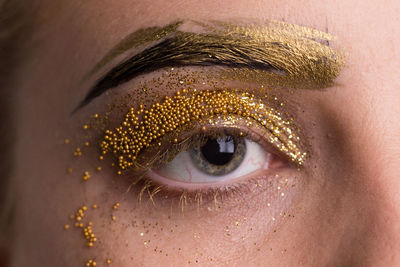 Close-up portrait of woman with eye make-up