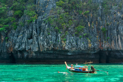 Man on boat sailing in sea