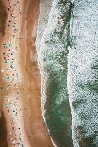 High angle view of rocks on rock against wall