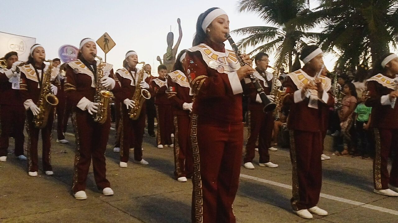 real people, large group of people, group of people, music, crowd, artist, men, musician, standing, arts culture and entertainment, clothing, musical instrument, street, full length, lifestyles, performance, celebration, event, musical equipment, festival, uniform