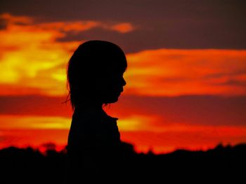 Silhouette of people at sunset