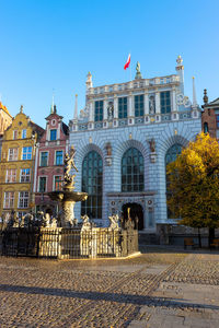 Facade of historic building against sky
