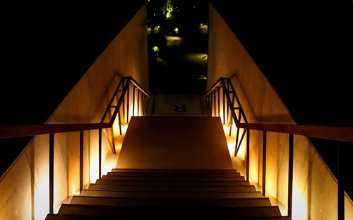 High angle view of illuminated steps at night