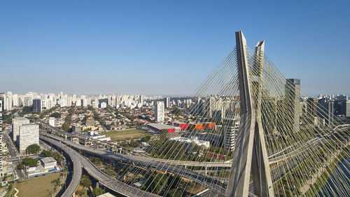 High angle view of bridge and buildings against sky