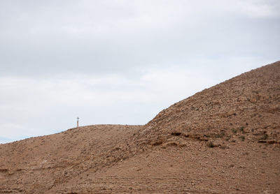 Scenic view of arid landscape against sky