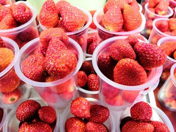 High angle view of strawberries in market for sale