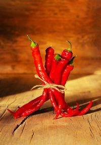 Close-up of red chili peppers on table