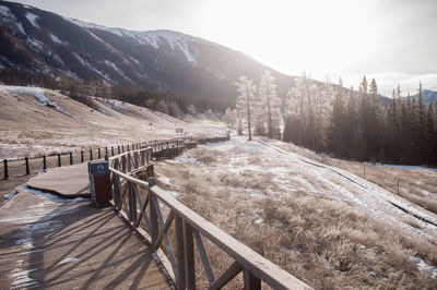 Scenic view of snow covered mountains against sky