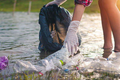 Low section of people working in water