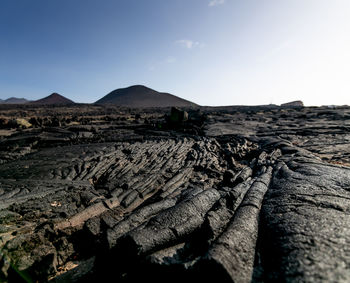 Scenic view of arid landscape against clear sky