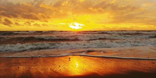 Scenic view of sea against sky during sunset