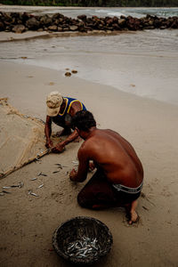 High angle view of men on beach