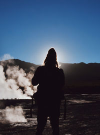 Silhouette of man standing on beach