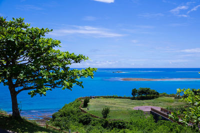 Scenic view of sea against blue sky