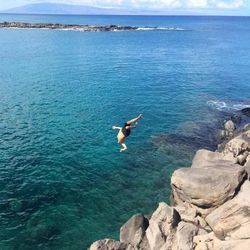 Scenic view of sea against blue sky