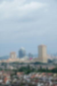 Defocused image of buildings against sky