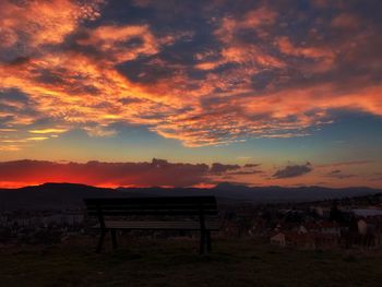 Scenic view of landscape against orange sky