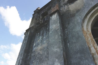 Low angle view of old building against sky