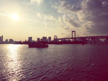 View of suspension bridge against cloudy sky