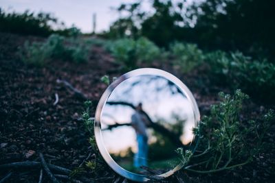 Close-up of mirror on land