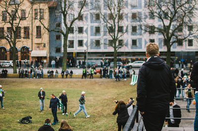 People at soccer field in city