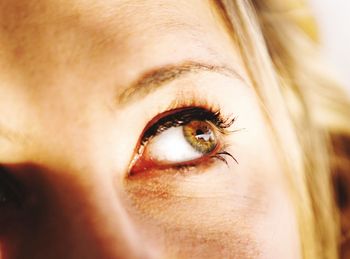 Cropped image of thoughtful woman with hazel eye