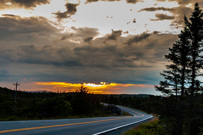 Road against dramatic sky during sunset